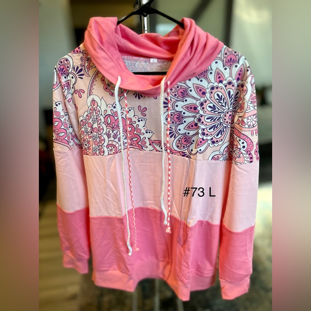 Multi colored pink design long sleeve L size. Brand new
